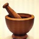 Stylized icon of a mortar and pestle, representing handcrafted quality.